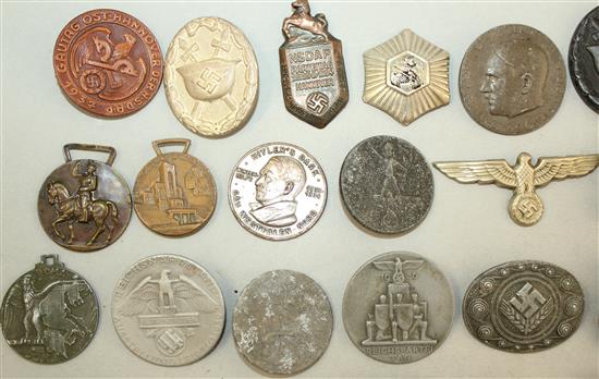 A large collection of various German Third Reich badges,